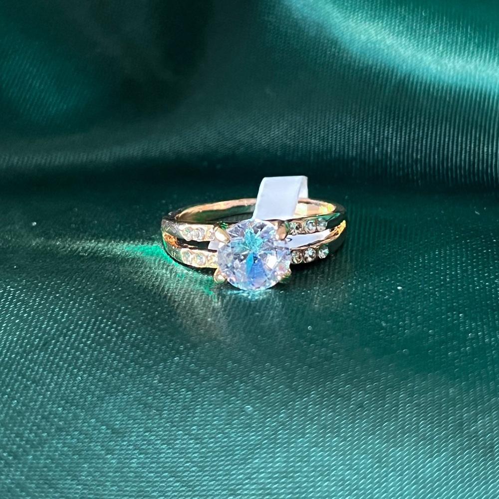 Gold Alloy Ring With Clear Gems